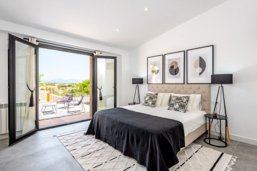 Schlafzimmer mit Panoramablick und direktem Terrassenzugang