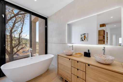 Freestanding bathtub with panoramic window outlook