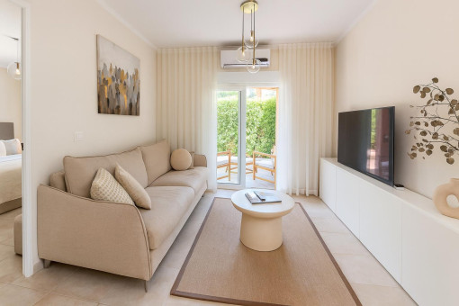05_living_room_access_terrace_bedroom_ground_floor_apartment_holiday_license_canyamel_Apartment_Canyamel